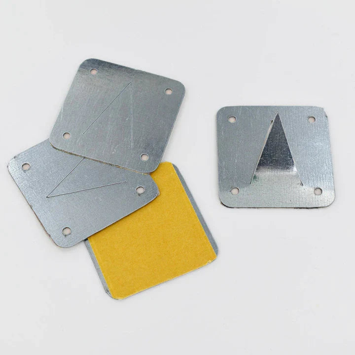 Three silver metal mounting plates, one with yellow adhesive backing, each with a triangular cut out.