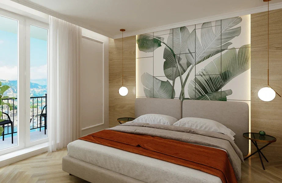 Bedroom with double bed, tropical leaf wall art, pendant lighting, and balcony.
