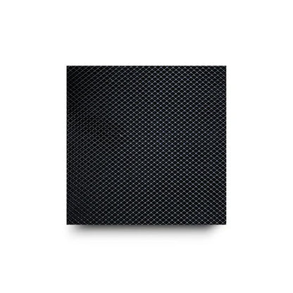 Close-up of a black diamond-patterned surface with a drop shadow.
