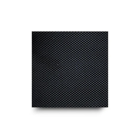 Close-up of a black diamond-patterned surface with a drop shadow.
