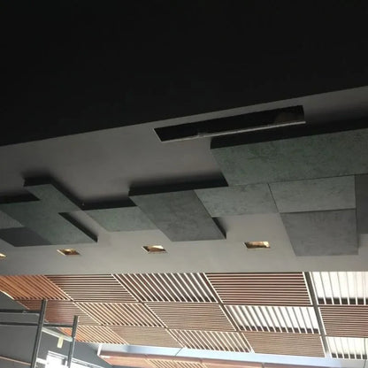 Ceiling with dark and patterned tiles, wooden slats, and recessed lighting.
