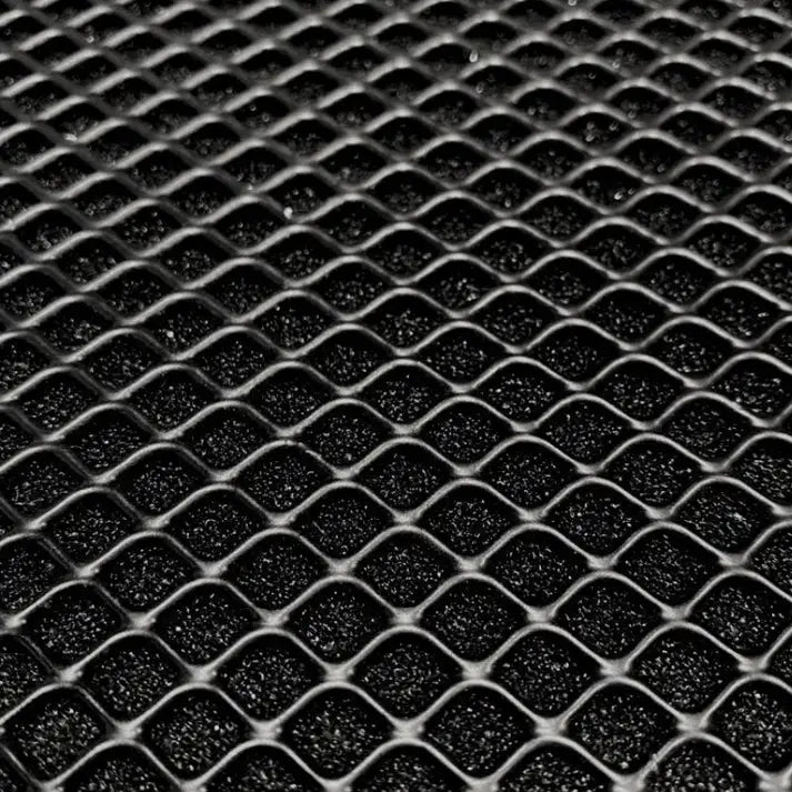 Black wire mesh over dark foam.
