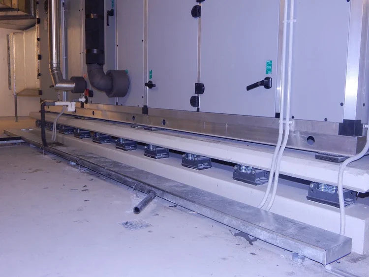 Industrial HVAC system with vibration isolation mounts.