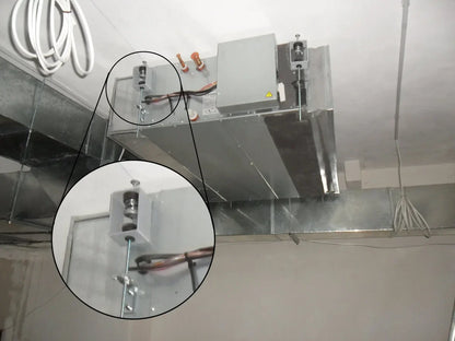 Ceiling-mounted HVAC system with metal ductwork.
