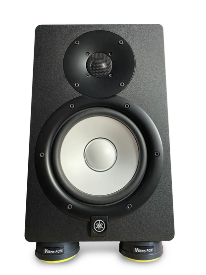 A black Yamaha studio monitor with a white woofer and a black tweeter, resting on Vibro FON isolation pads.
