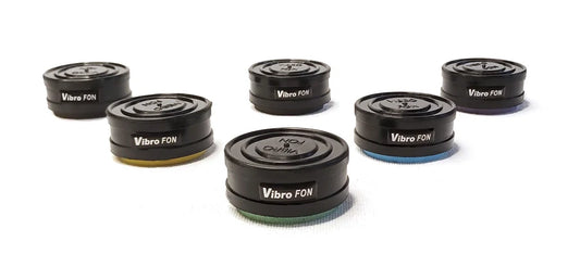Six black, round Vibro FON discs with colored bases.