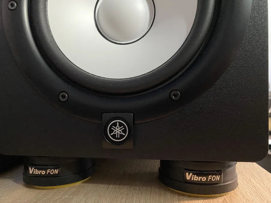 Close-up of a Yamaha studio monitor sitting on Vibro FON isolators.