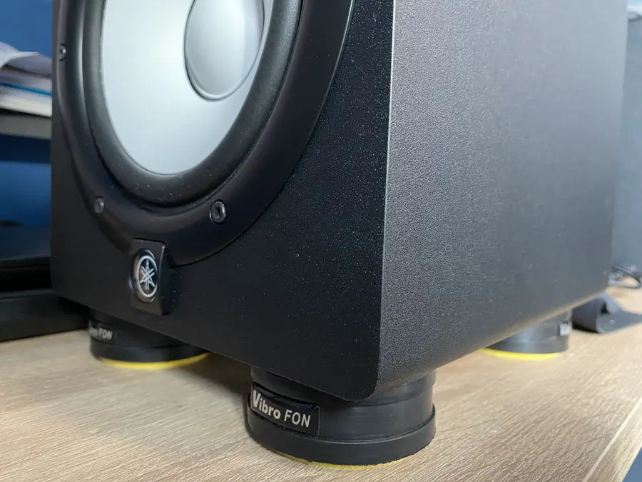 Close-up of a black Yamaha speaker with Vibro-FON isolation feet.
