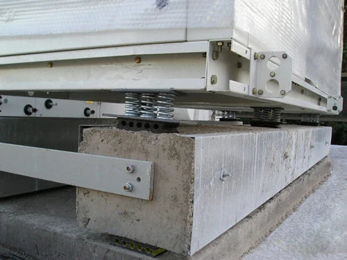 Industrial equipment on spring mounts.