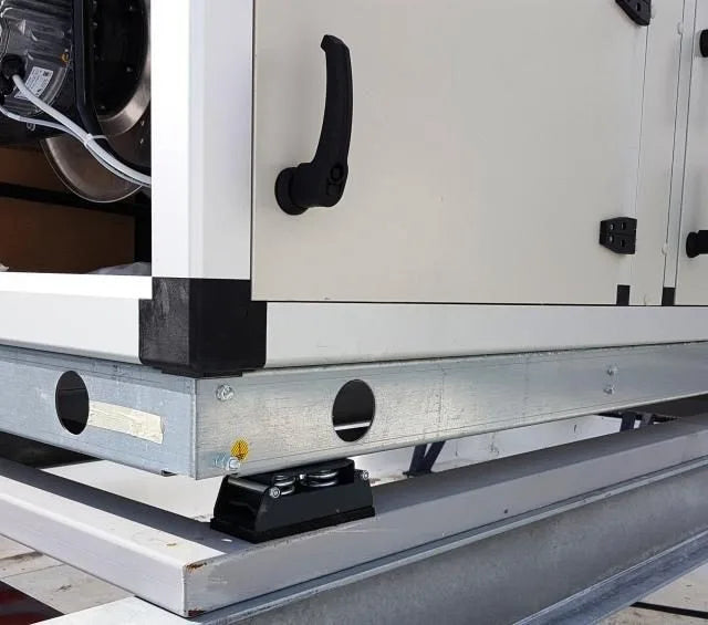 Close-up of industrial HVAC unit with metal frame.