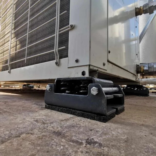 Air conditioning unit on vibration isolation mounts.