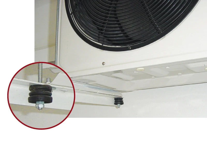 Close-up of HVAC unit with vibration dampeners.
