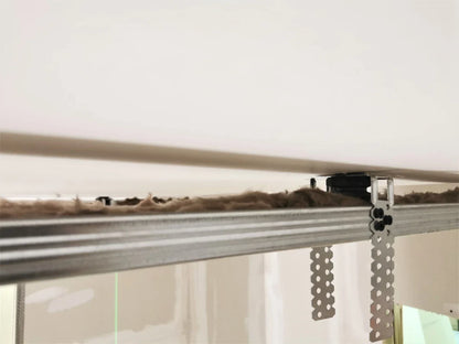 Close-up of a metal ceiling track with insulation above.