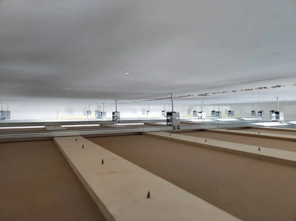 Overhead shot of ceiling framing with metal supports.